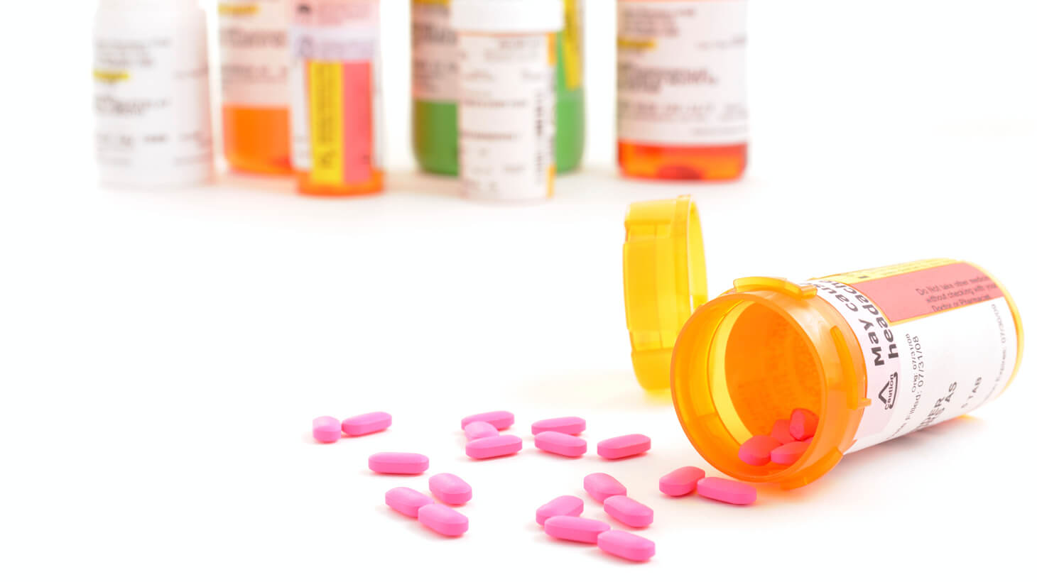 Prescription pill bottles and pink pills